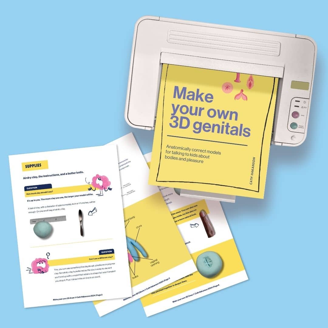 printer with some pages from the female and male reproductive system anatomy model