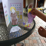 child playing with the anatomically correct paperdolls and the bonus house