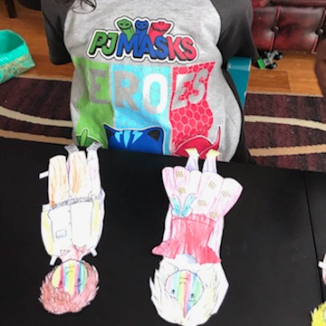 child playing with the anatomically correct paperdolls 