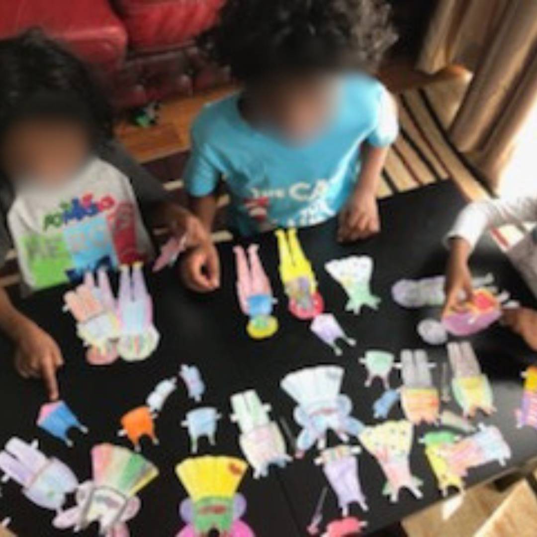 photo of kids playing with the anatomically correct paper dolls